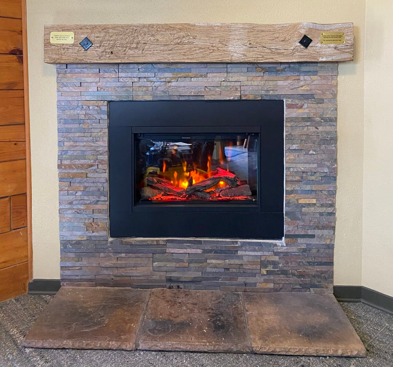 Kozy Heat Osseo e29 electric insert installed in a stone fireplace surround