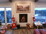 Living room with Christmas decorations, fireplace, and snowy outdoor view.