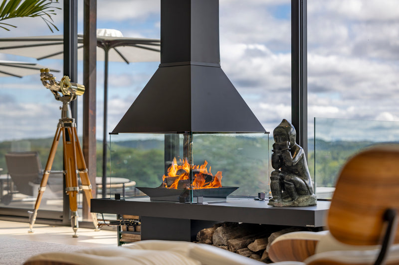 Don-Bar wood fireplace framed by panoramic windows