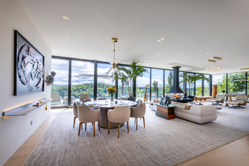 Wide view of a lakeside residence with a Don-Bar fireplace