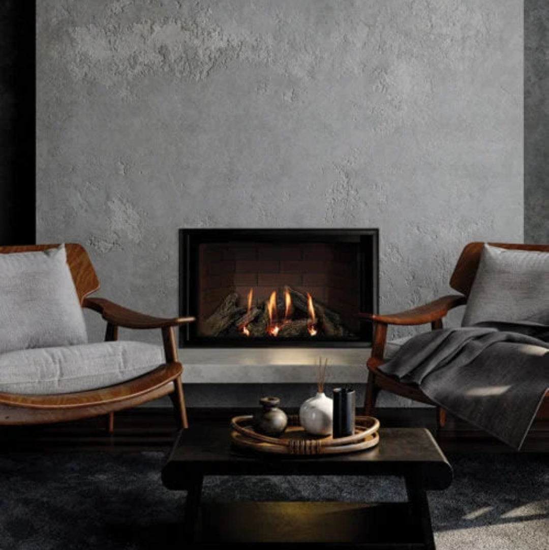 Cozy living room with a fireplace, wooden chairs, and a coffee table.