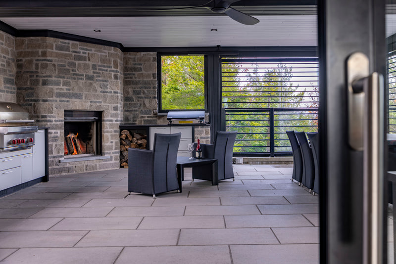 Renaissance Rumford 1000 wood fireplace in an outdoor living space in Rigaud