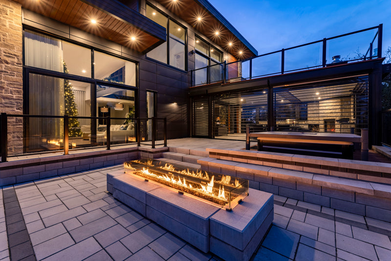 Woodbridge Fire 84 outdoor gas burner in a contemporary Rigaud patio